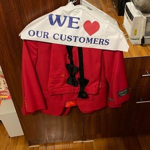 Joseph Dan red suits in a size 7 in kids. Tie and white shirt included.